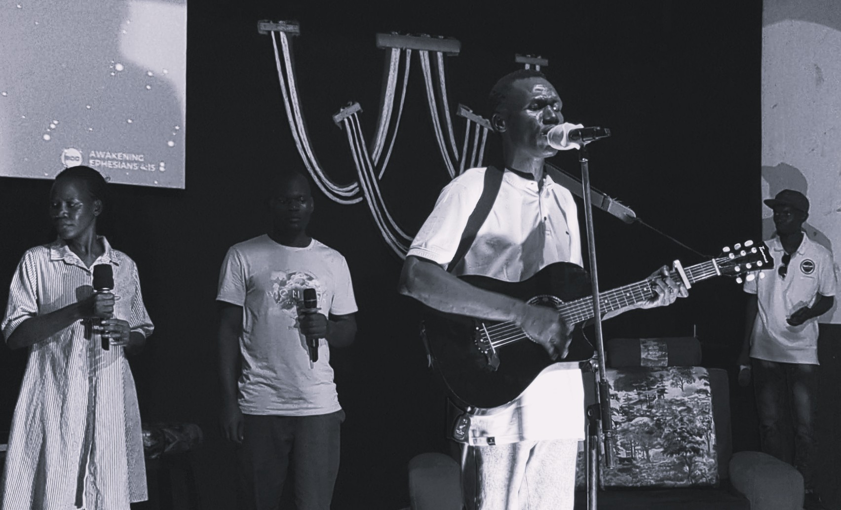 Jesse Mabonga leading worship with a live band